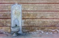 Old, ornate, embossed white marble fountain on a historical wall Royalty Free Stock Photo