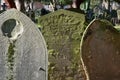 Old gravestones in the historic South Ealing Cemetery, Victorian burial ground in west London UK.