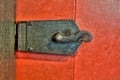 Old ornate metal lock on red door Royalty Free Stock Photo