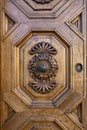 Old ornate wooden door with beautiful carvings Royalty Free Stock Photo
