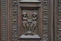 Old ornate wooden door with beautiful carvings Royalty Free Stock Photo