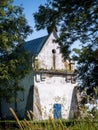 Old orthodox church with blue door surrounded by green trees Royalty Free Stock Photo
