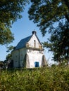 Old orthodox church with blue door surrounded by green trees Royalty Free Stock Photo