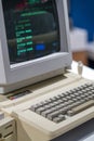 Old and outdated Apple computer. A working version with a black-and-green screen. Royalty Free Stock Photo