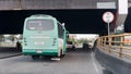 Old, outdated, highly polluting bus being driven on 68th street in Bogota, Colombia. Bridge; tunnel.