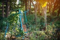 Old outdoor exercise equipment so worn out and covered in trees in outdoor exercise park. Old abandoned gym equipment on sports Royalty Free Stock Photo