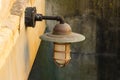 Old outdoor light fixture in a stairwell Royalty Free Stock Photo