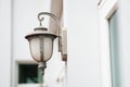 Old outdoor wall lamp light on white exterior Royalty Free Stock Photo