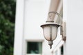 Old outdoor wall lamp light on white exterior Royalty Free Stock Photo