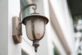 Old outdoor wall lamp light on white exterior Royalty Free Stock Photo