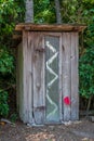 An Old Outhouse in the Woods