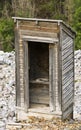 An Old Outhouse in a Rocky Mountain Ghost Town Royalty Free Stock Photo