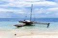 Old outrigger canoe in South Pacific shore Royalty Free Stock Photo
