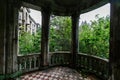 Old overgrown balcony in old abandoned mansion Royalty Free Stock Photo