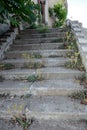 Old overgrown with destroyed stone balustrades old antique steps of a stone staircase. Ruined stairs. The dilapidated building, Royalty Free Stock Photo