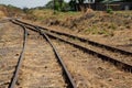 Old overgrown used railway tracks intersection merge Royalty Free Stock Photo