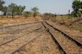 Old overgrown used railway tracks intersection merge Royalty Free Stock Photo