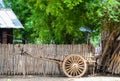 Old ox cart in front of a burmese house Royalty Free Stock Photo