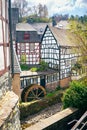 Old paddle wheel and traditional half timbered houses in a historic German town Royalty Free Stock Photo