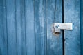 Old padlock and blue boards keep door locked Royalty Free Stock Photo