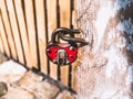 Old padlock hanging by the door