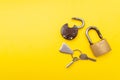 Old padlock and key on a yellow background. Copy space Royalty Free Stock Photo