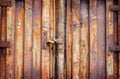 Old padlock on rusty garage collars Royalty Free Stock Photo