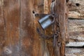 Old padlock on a wooden door. Rusty granary lock Royalty Free Stock Photo