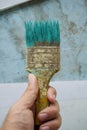 Old paint brush on man hand Royalty Free Stock Photo