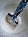 Old Paint Brush in Tin of White Paint Royalty Free Stock Photo