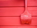 old paint brush on wood background .