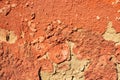 The old paint texture breaks off and collapses when dropped. Pink flaky stucco and cement on the outer wall of a building. Royalty Free Stock Photo