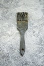 Old paintbrush on the cement dusty floor Royalty Free Stock Photo