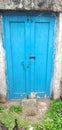 Old painted blue color backyard closed  door Royalty Free Stock Photo