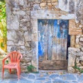 Old painted blue door on the ancient stone wall, Greece Royalty Free Stock Photo