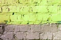 Old painted brick wall brown and green colors. Abstract background Royalty Free Stock Photo