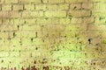 Old painted brick wall brown and green colors. Abstract background Royalty Free Stock Photo