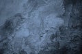 Old painted concrete wall surface. Close-up. Gray blue color. Rough dark background. Royalty Free Stock Photo