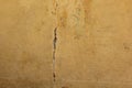 Old painted cracked concrete wall. brown background. texture of the slain wall Royalty Free Stock Photo