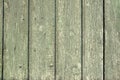 Old painted green faded wood fence background