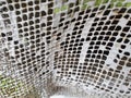 Old painted metal fencing mesh. Royalty Free Stock Photo