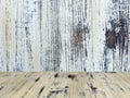 Old painted washed oak wood table on the blurry white wood wall background, wooden table