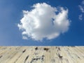 Old painted washed oak wooden table on the blue sky clouds background, wood table