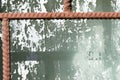 Old painted window behind iron bar. Grunge background Royalty Free Stock Photo