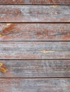 Old painted wooden red brown gray background. Weathered cracked texture.