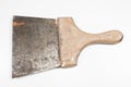 Old painter`s spatula with rust with wooden handle on white background Royalty Free Stock Photo