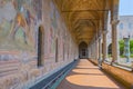Old paintings decorate the cloister walls of Santa Chiara Monastery in Naples, Italy