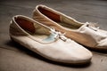 An old pair of ballet shoes abandoned and forgotten