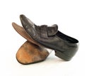 Old pair of Mens leather black dress shoes that are worn out, very dusty and dirty and falling apart.  They need polish and repair Royalty Free Stock Photo