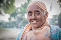 Old Pakistani woman begging on the street